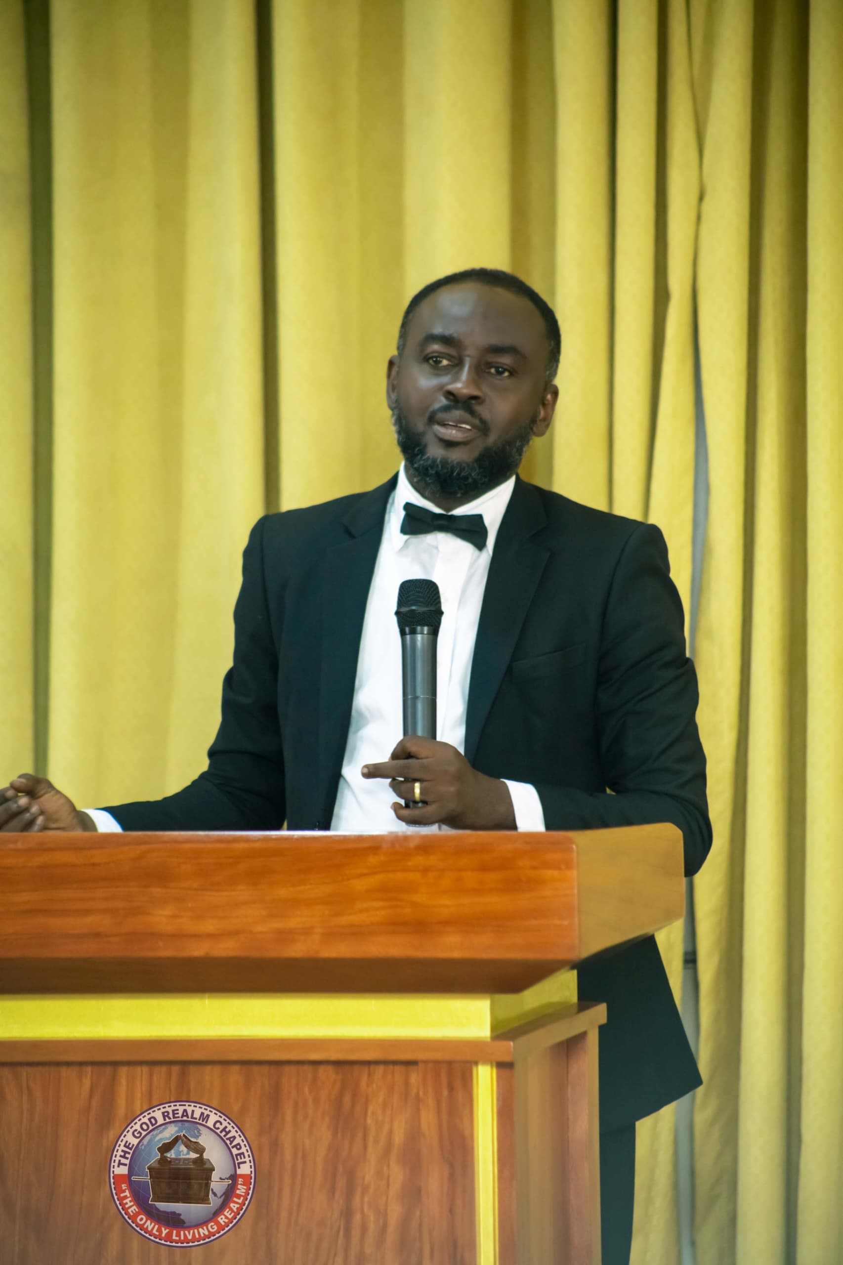 Apostle Benjamin Asamoah speaking at the pulpit