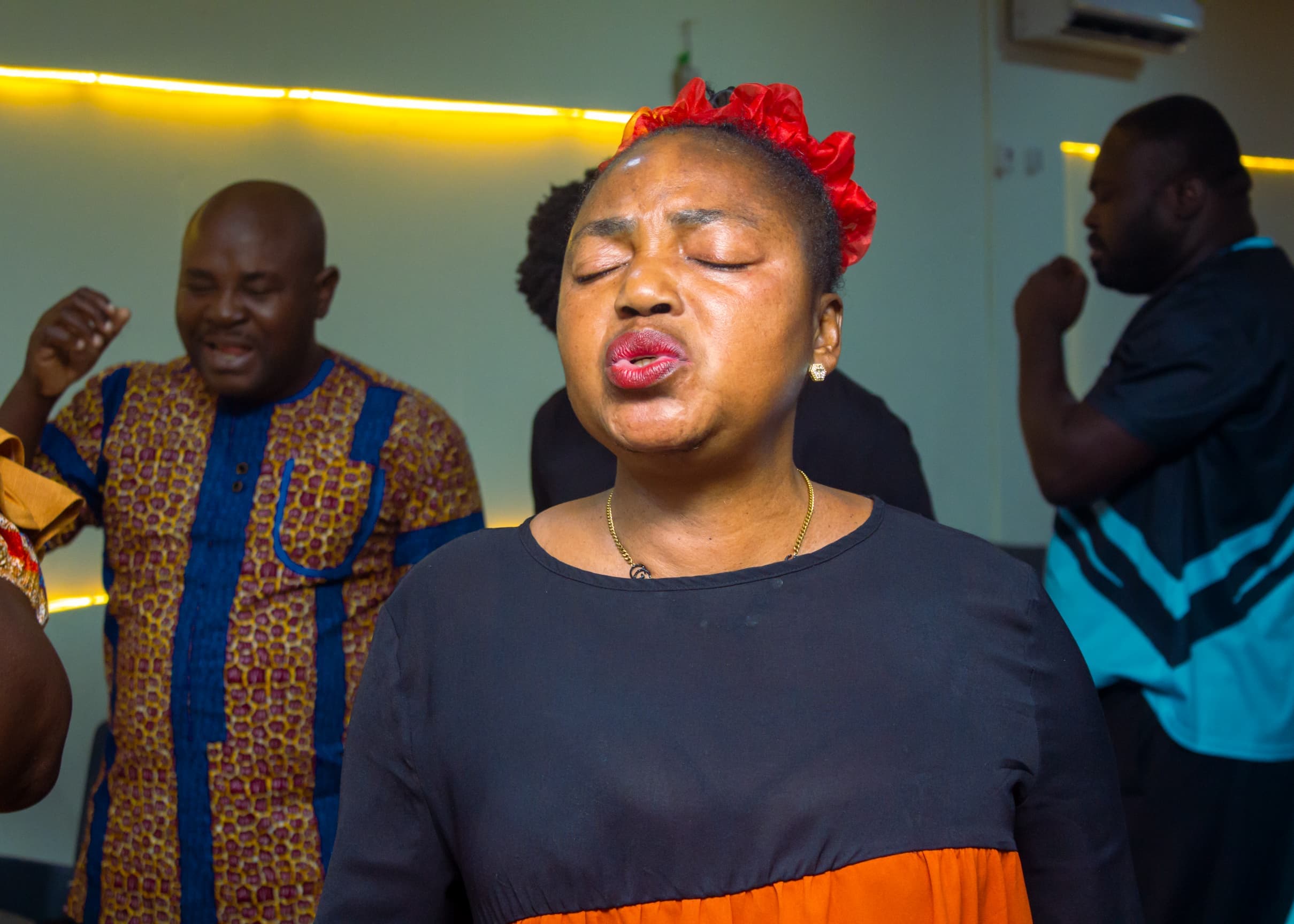 Woman in deep devotion during a church service