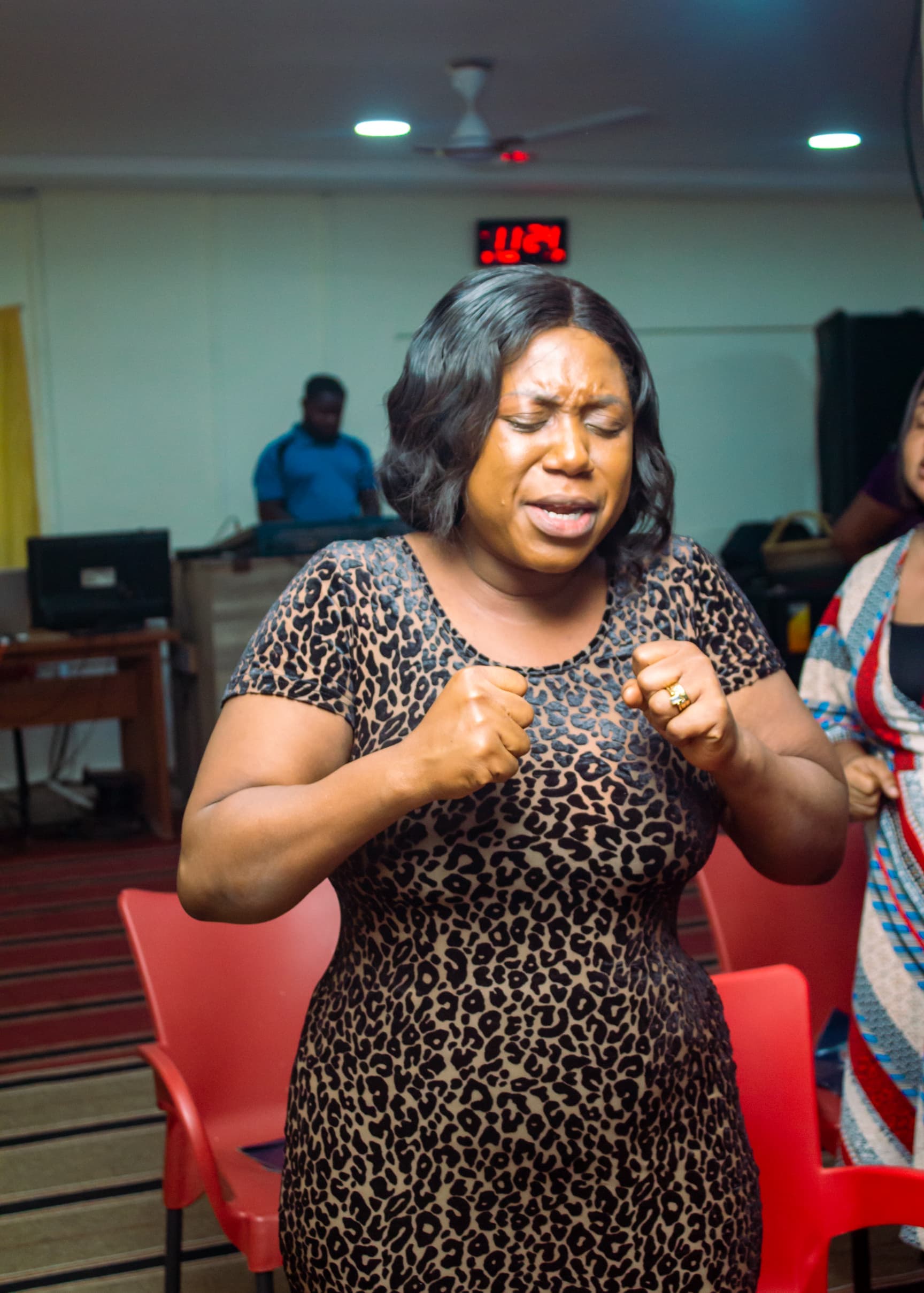 Woman in fervent worship during a church service