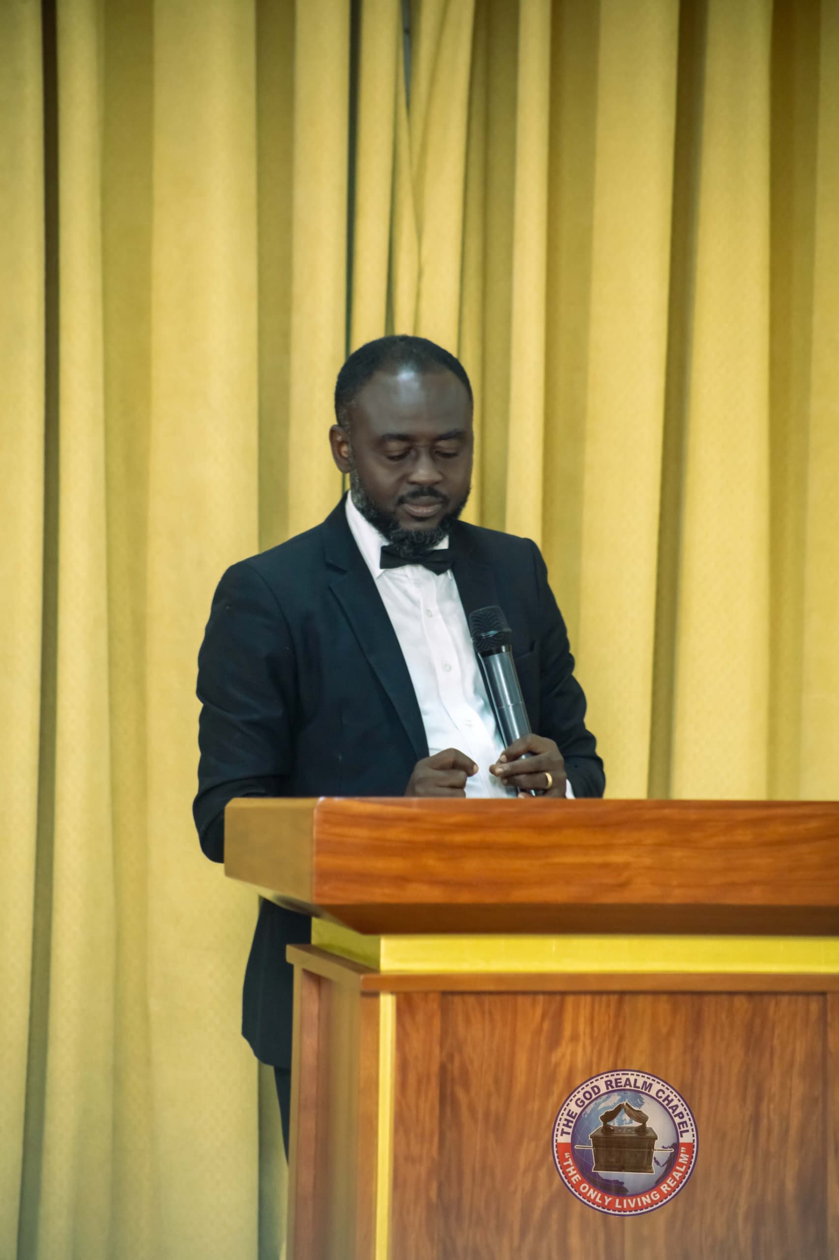 Apostle Benjamin Asamoah preaching from the pulpit
