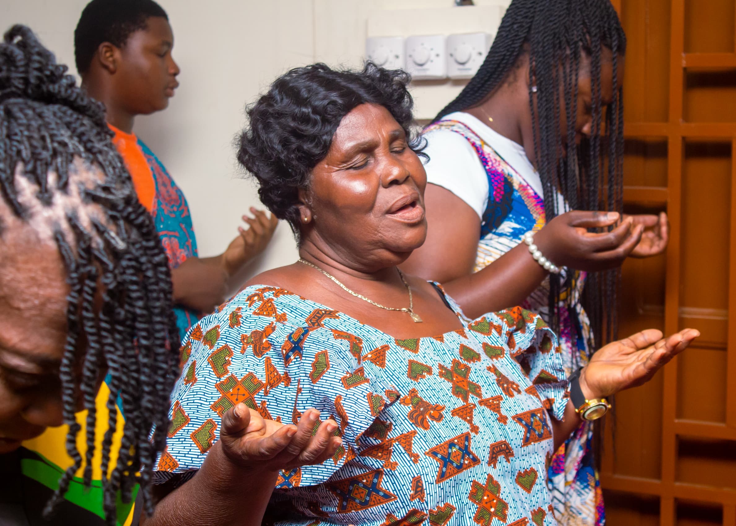 Congregation praying together during a worship service