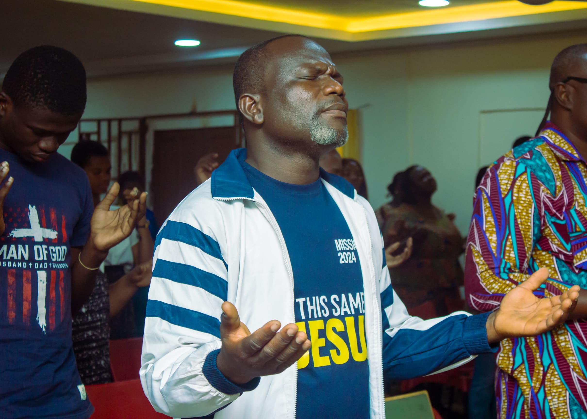 Man worshipping during Mission 2024 at The God Realm Chapel