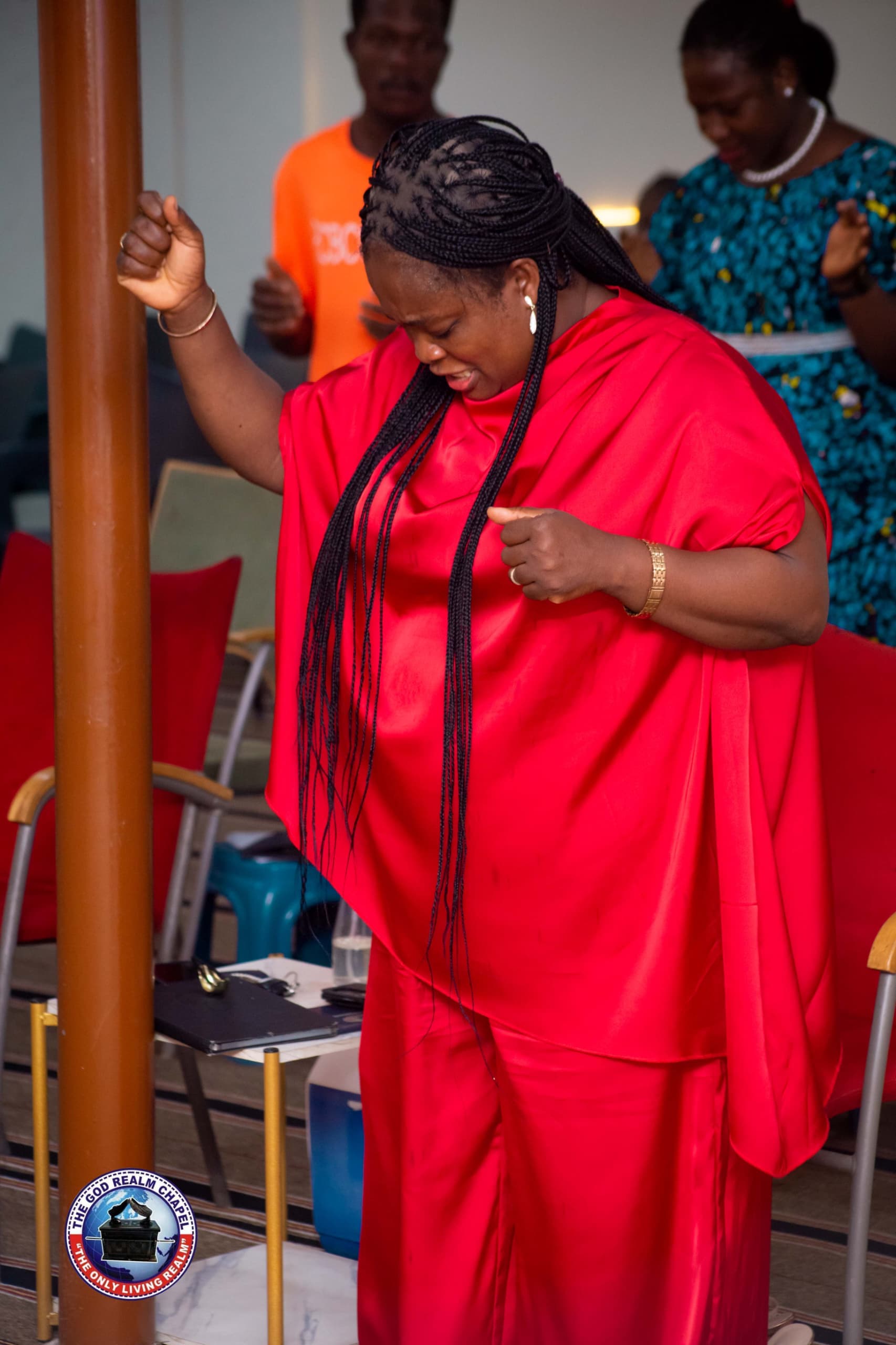 Woman in prayer during a worship gathering