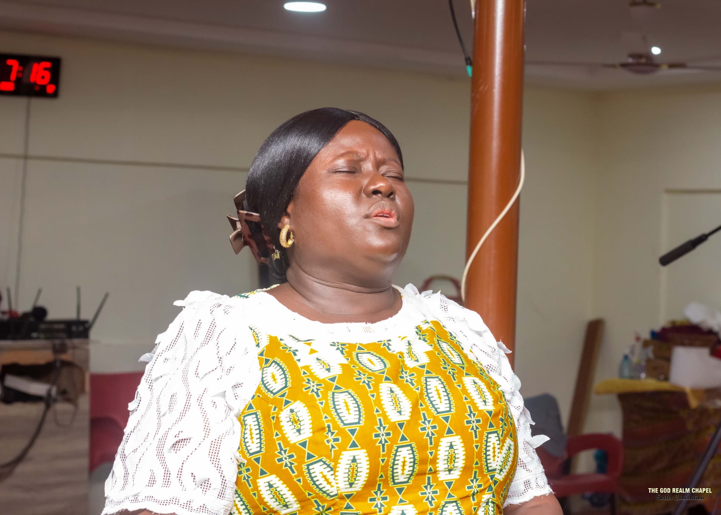 Woman worshipping at The God Realm Chapel Easter Convention